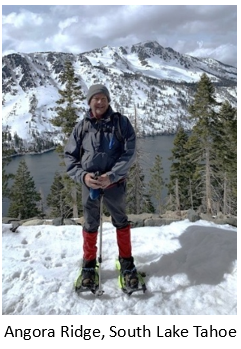 standing in snow on a mountain